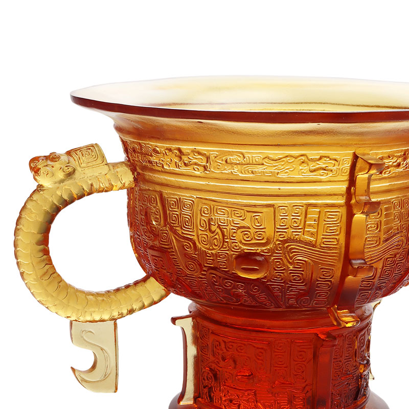 Treppiede cinese con manico a forma di orecchie di drago e motivo a spine